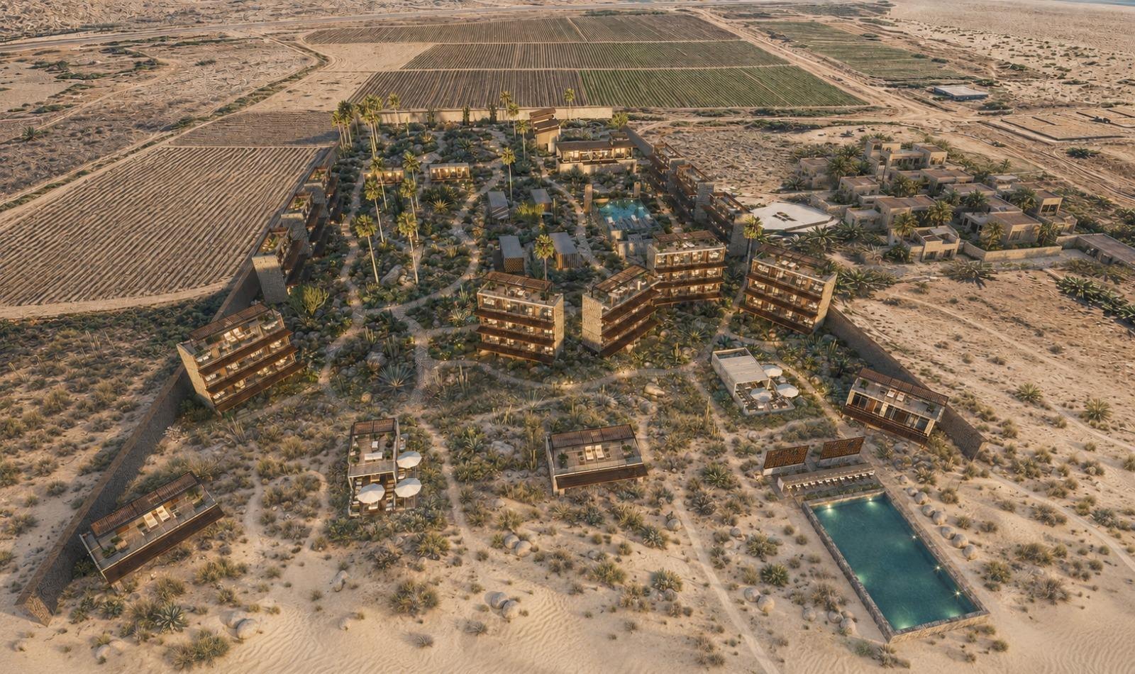 Overhead aerial view of the entire Holón Phase 1 resort: residential blocks, wellness complex, pools, pavilions and operations set within the desert plain